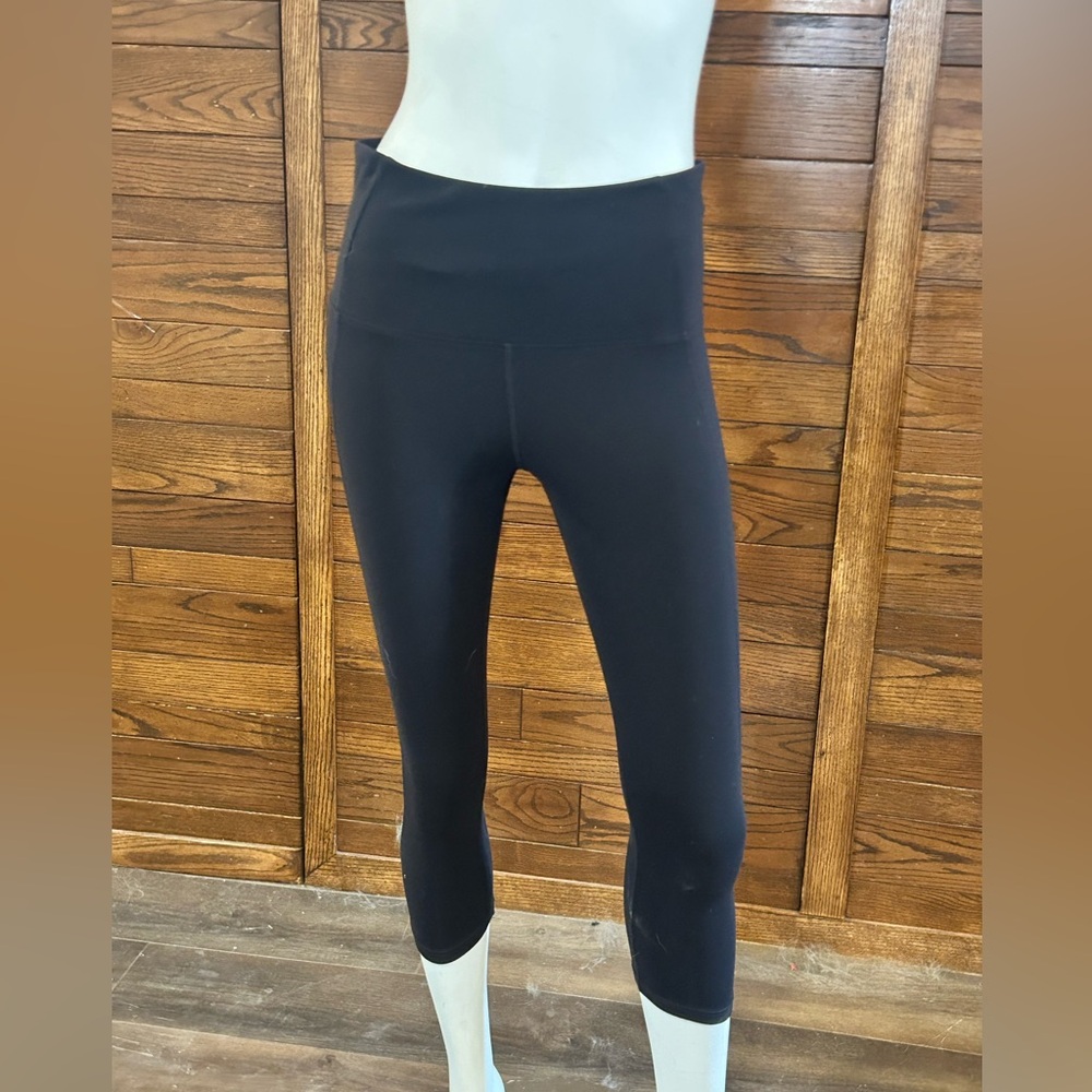 Tuff Athletics. Capri length. Size medium. Black. Active wear tights.Zip pocket